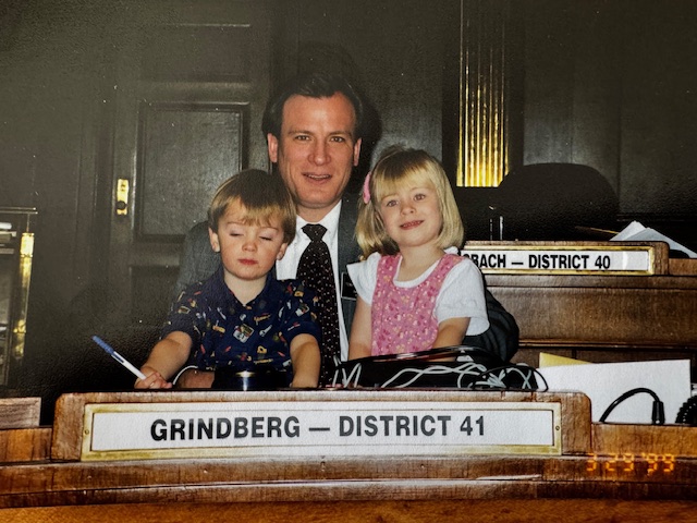 Tony Grindberg at the senate desk with his kids